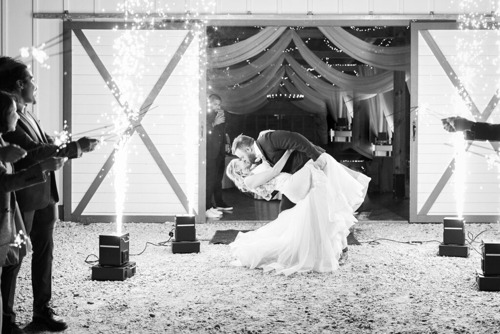 Love Ignites: Newlyweds Surrounded by Extravagant Dry Ice Sparklers at the Reception - A grand farewell filled with enchantment.