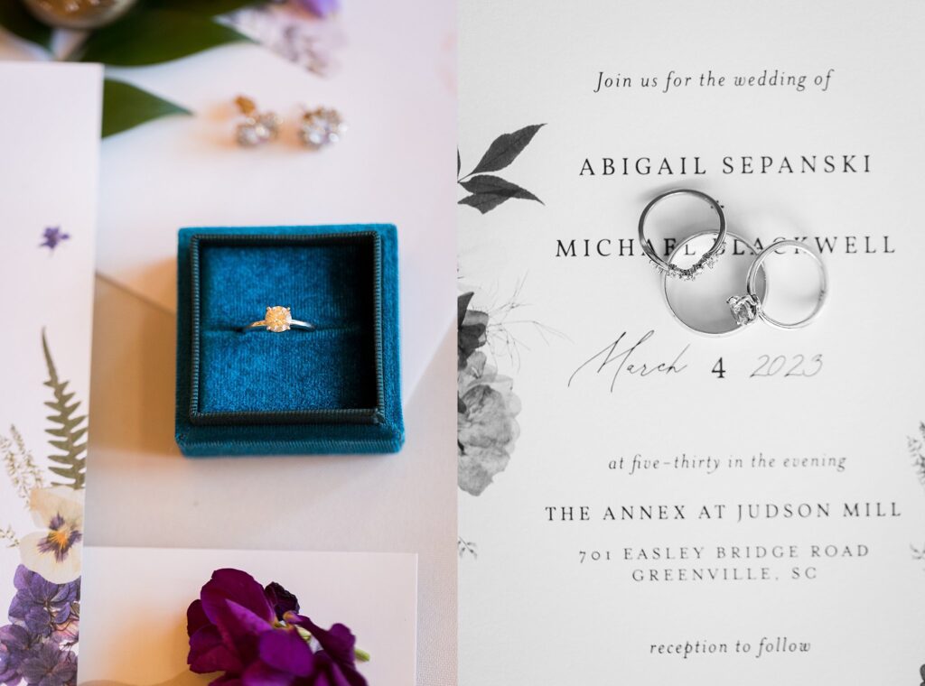 A beautifully arranged bridal detail flatlay showcasing the wedding invitation suite at Judson Mill in downtown Greenville, South Carolina. Delicate floral motifs and elegant typography adorn the invitation, setting the tone for an unforgettable wedding celebration.