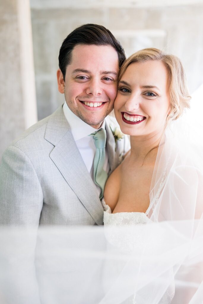 A stunning close-up of the bride's radiant smile, showcasing her natural beauty on her special day at Judson Mill.