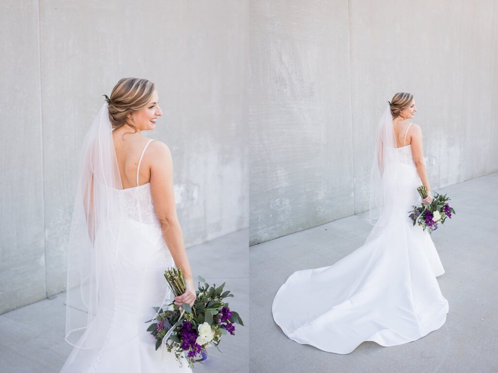 Enchanting bride adorned in her bridal gown, holding a stunning bouquet, poses gracefully at the picturesque Judson Mill in downtown Greenville, South Carolina.