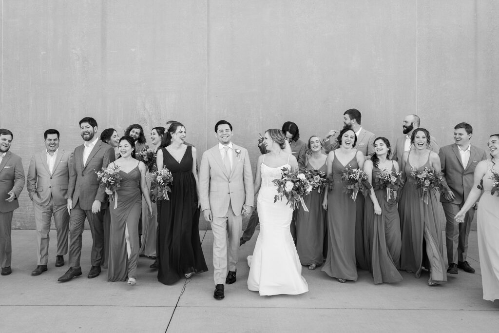 Capturing the love and laughter of the bridal party amidst the rustic charm of Judson Mill in downtown Greenville, South Carolina.
