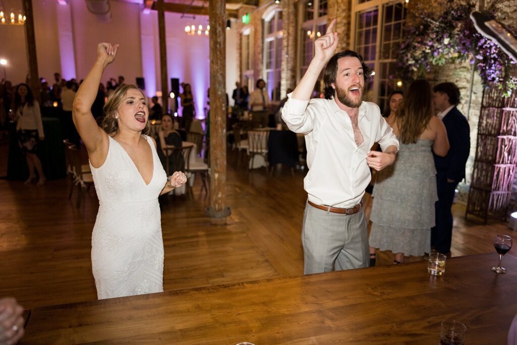 Guests showing off their moves during an epic dance party at Judson Mill wedding