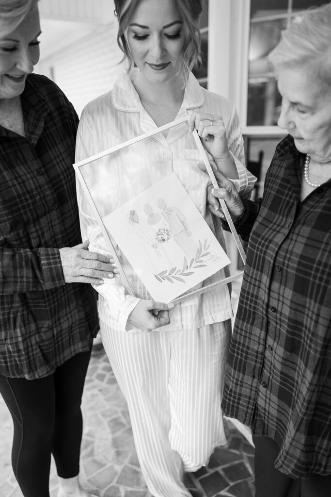 Heartwarming moment of the bride getting ready with her mom and grandma, capturing generations of love and support, beautifully captured by Lace + Honey