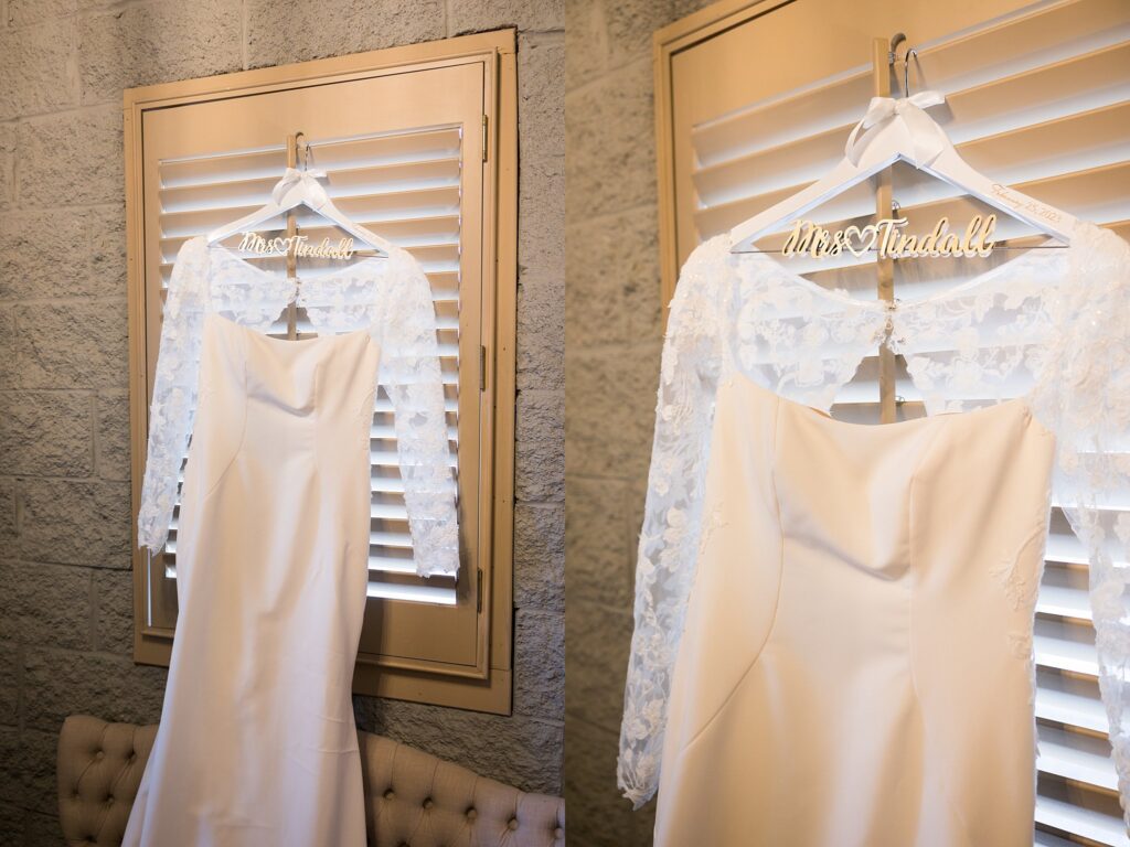 Lace + Honey's photograph of the bride's dress elegantly displayed, ready to be worn on her special day
