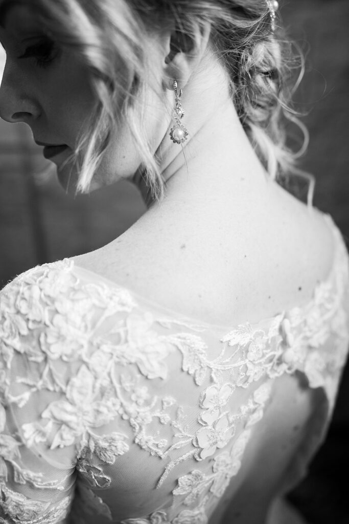 Lace + Honey's image of the bride's hairpiece, delicately placed to enhance her bridal look