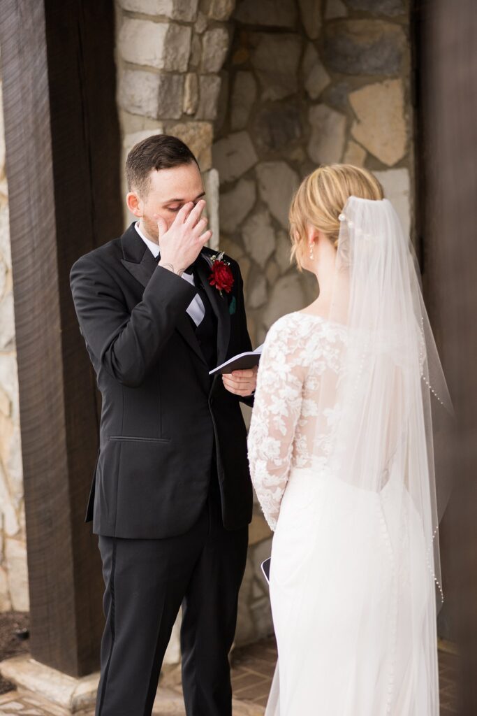 Lace + Honey's photo of the tender moment when the bride and groom read their letters to each other at Glassy Chapel.