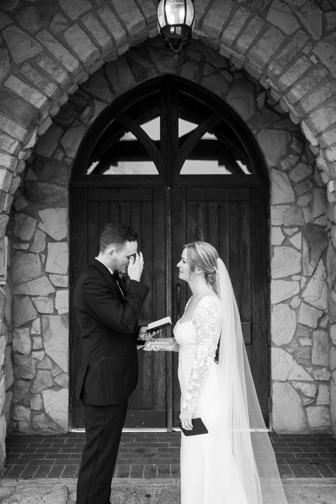 Emotional first look between the bride and groom at the Cliffs at Glassy Chapel, captured by Lace + Honey.