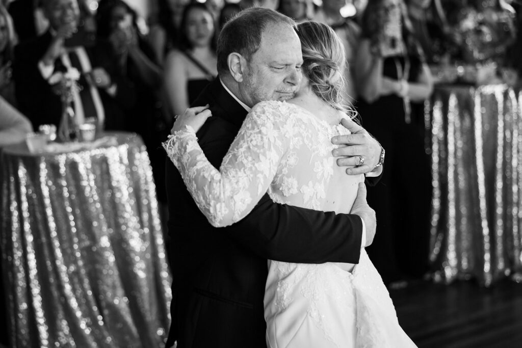 Heartwarming father-daughter dance moment at wedding, photographed by Lace + Honey