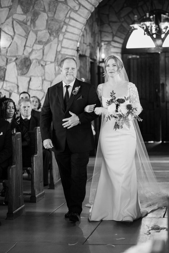 Image of a serene wedding ceremony at Glassy Chapel by Lace + Honey