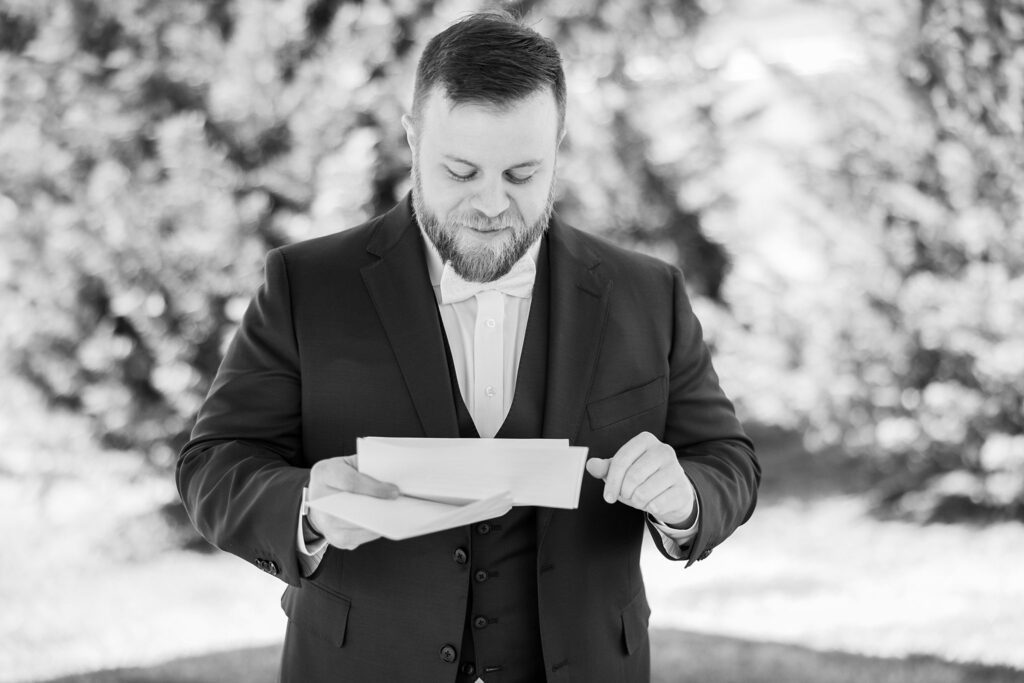 Sentimental Moment: Groom reading his letter at South Wind Ranch, Travelers Rest SC - Capturing the emotional connection before exchanging vows
