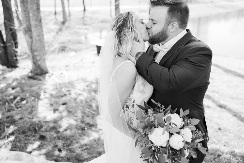 Romantic Kiss: Bride and Groom Lost in Each Other at South Wind Ranch, Travelers Rest SC - Celebrating their union with a heartfelt kiss.