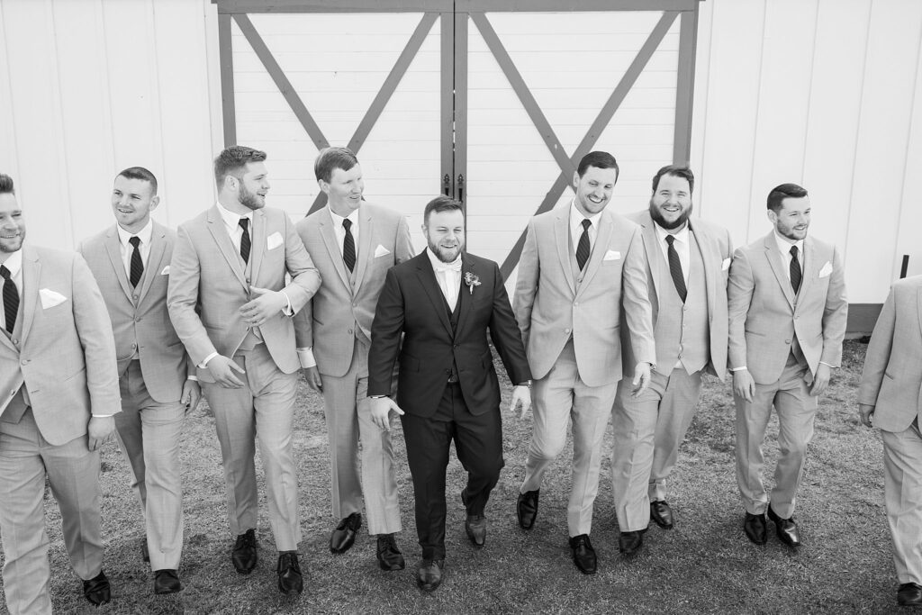 Walking in Unity: Groomsmen Photos at South Wind Ranch - A united group, walking together in anticipation of the celebration