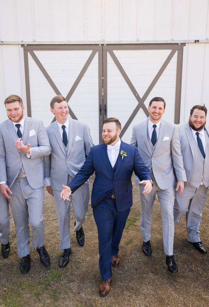 Fun-filled Moments: Groomsmen Walking at South Wind Ranch - Candid shots capturing the joy and laughter of the groomsmen