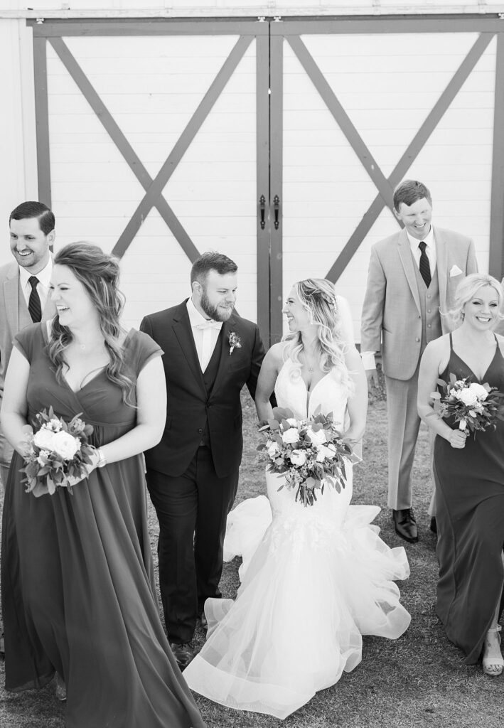 Bride and Groom Leading Their Full Bridal Party: A Joyful Walk at South Wind Ranch - Leading their excited bridesmaids and groomsmen towards a day full of celebration