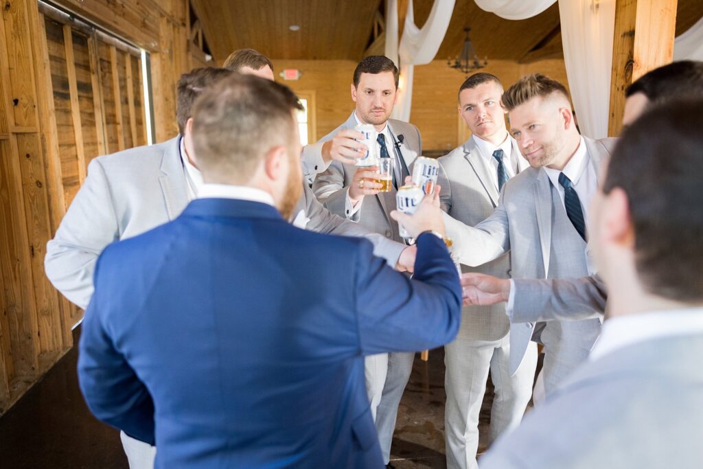 Groomsmen's Bond: Raising a Toast Before the Reception at South Wind Ranch - Celebrating the joyous occasion with camaraderie and laughter