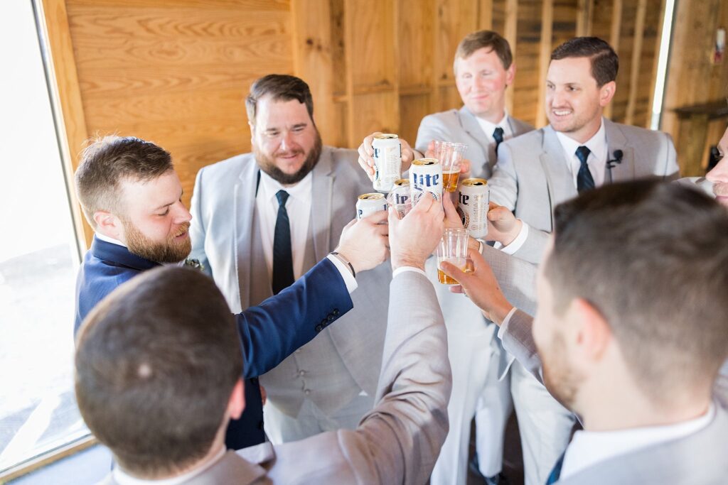 Fun-filled Anticipation: Groomsmen Taking Shots at South Wind Ranch - Capturing the excitement and spirits running high before the reception