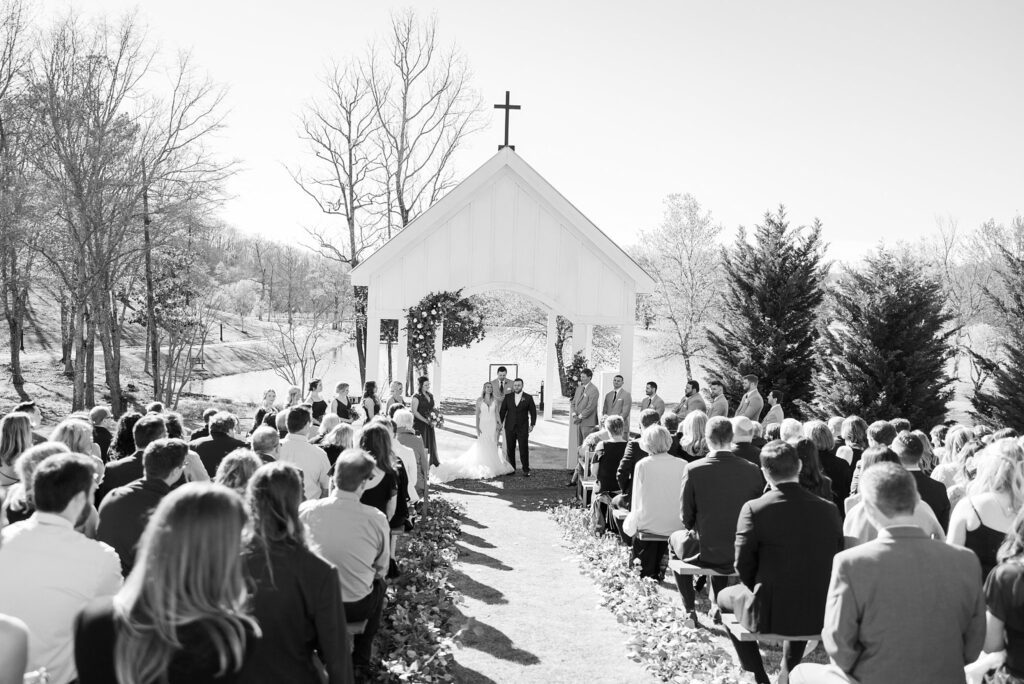 Blissful Exit: Bride and Groom Embarking on a New Chapter at South Wind Ranch - Capturing their joy and excitement as they leave hand in hand after a heartwarming ceremony