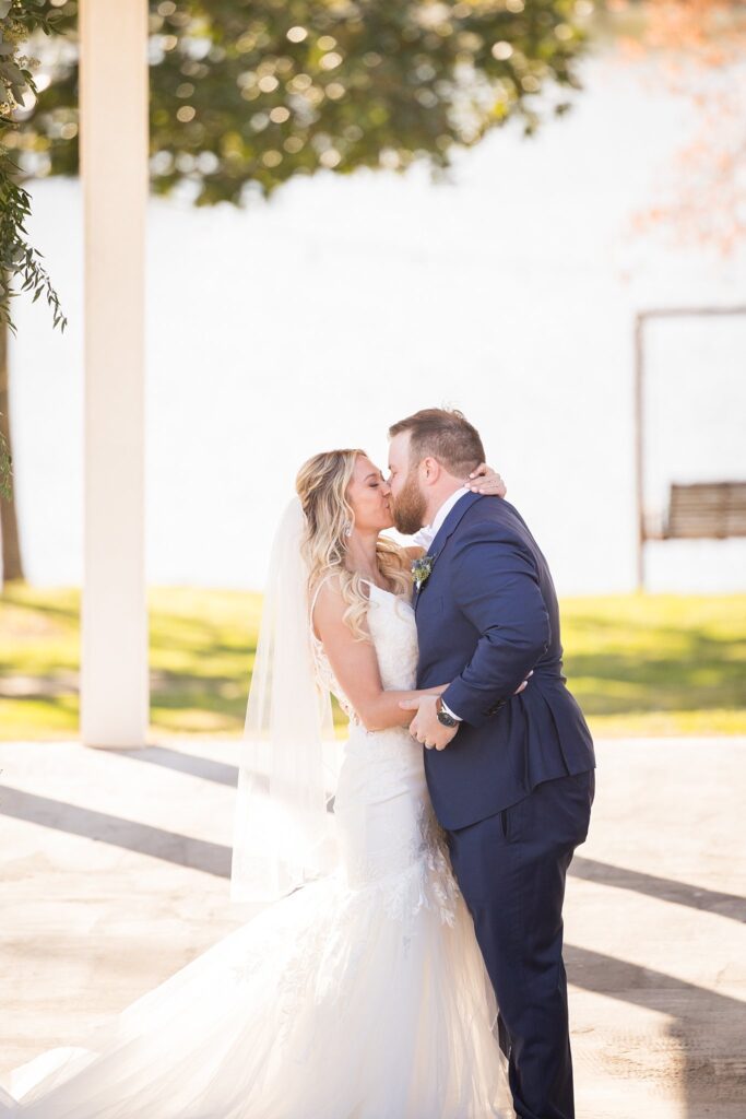 Sealing Their Love: Bride and Groom's First Kiss at the Ceremony - A magical moment as they share their first kiss as a married couple.