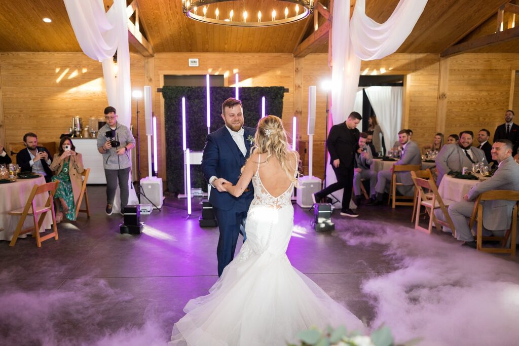 In the Spotlight: Bride and Groom's First Dance with Fog and Sparkler Effects - A captivating moment, as if time stands still