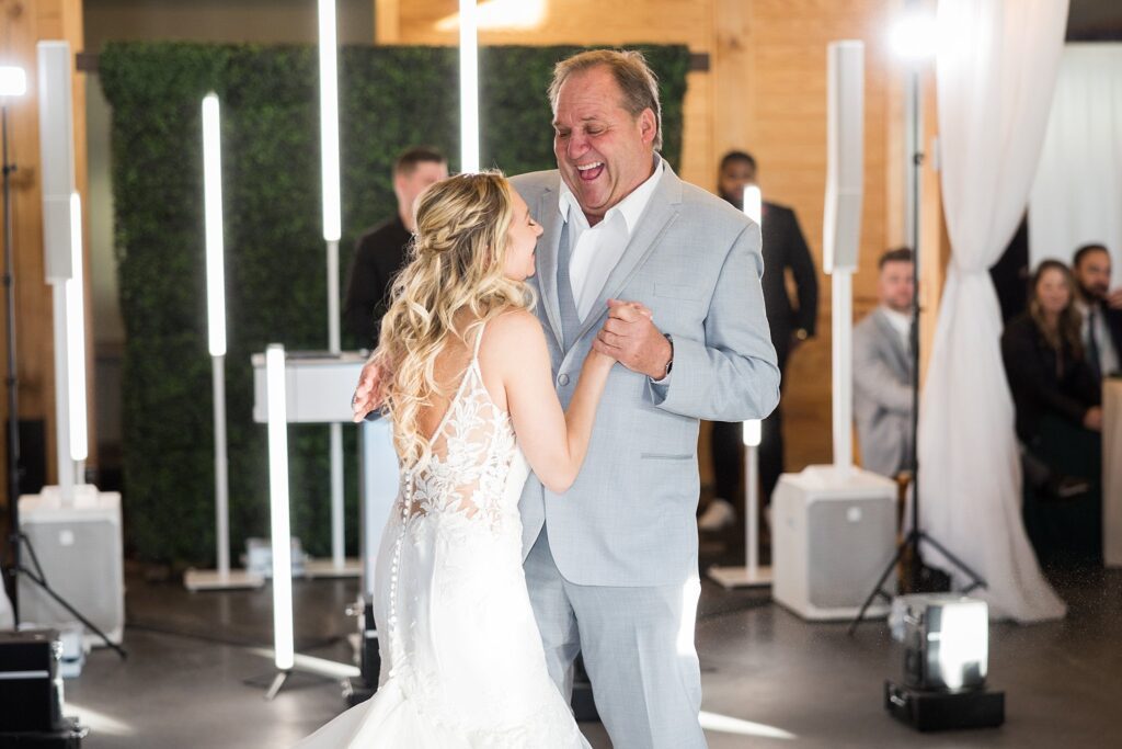 Tender Father-Daughter Dance: Bride and Groom Capturing a Precious Moment - A beautiful expression of the lifelong bond between a father and his daughter
