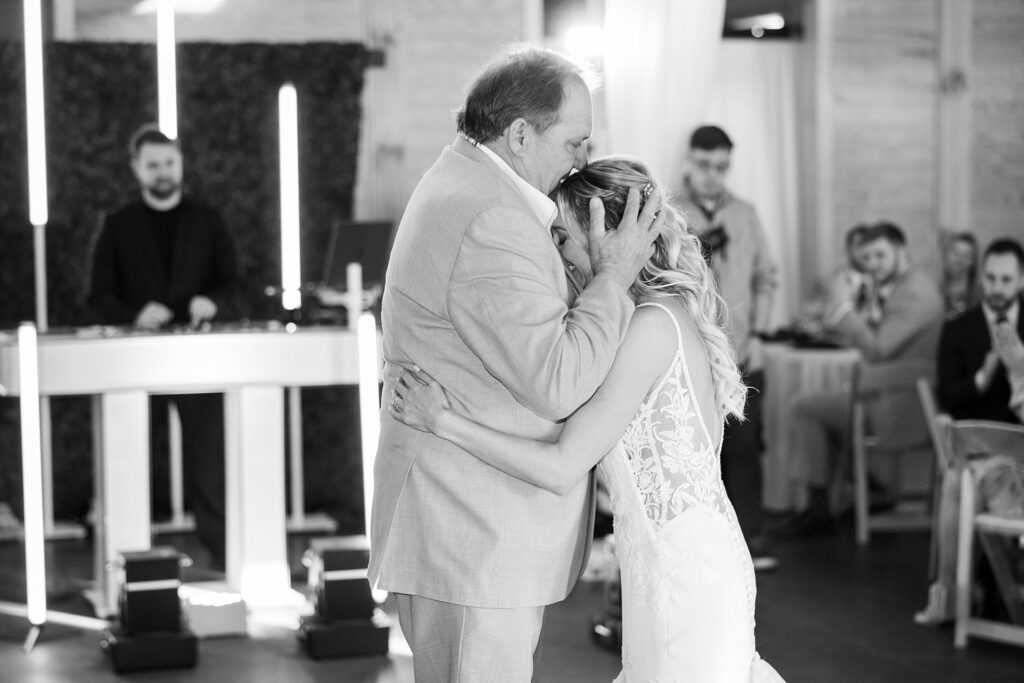 Dancing with Dad: Bride and Groom's Tender First Dance - Their hearts full of gratitude and love as they dance with her father on her wedding day.