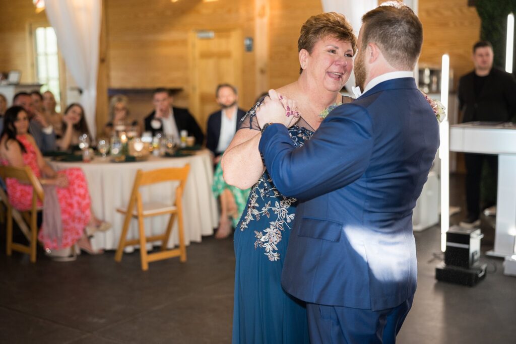 Heartfelt Embrace: Groom and His Mom Sharing Their First Dance - A beautiful display of affection and appreciation, capturing the cherished bond between a mother and her son