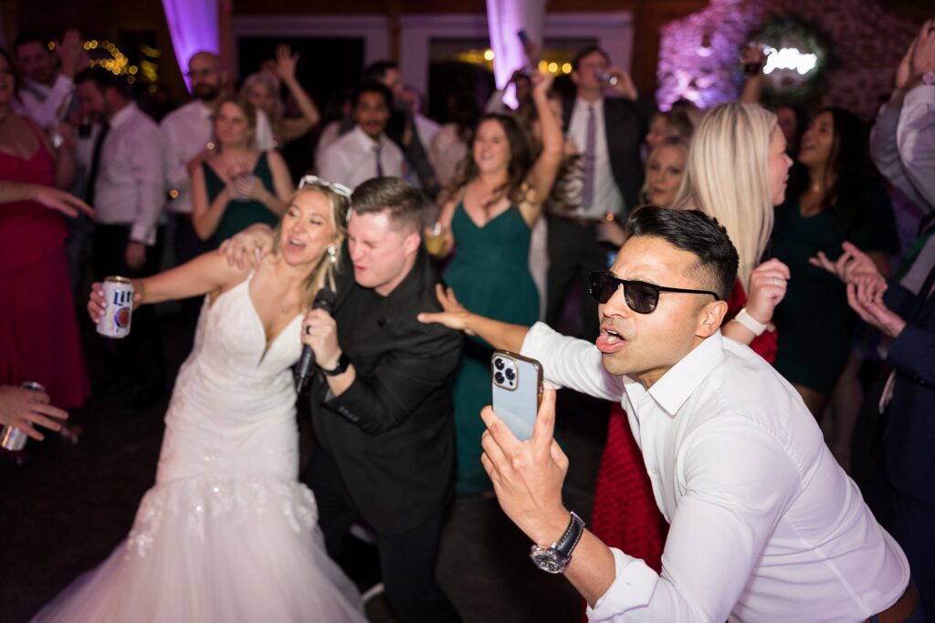 Energetic Celebration: Guests, Bride, and Groom Dancing with Gusto at South Wind Ranch - A Vibrant Wedding Party