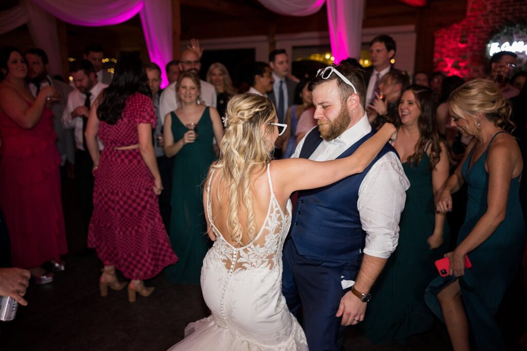 Dancing Delight: Memorable Wedding Party at South Wind Ranch - Guests, Bride, and Groom Savoring the Moment.