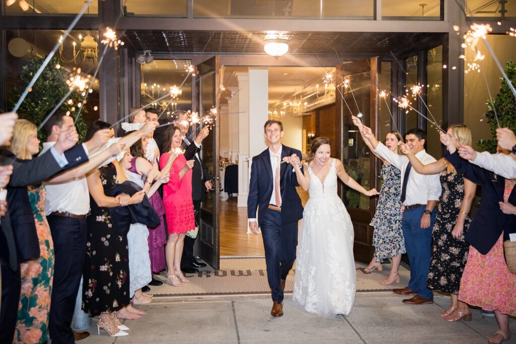 A whimsical finale to a beautiful wedding day, with sparkler sendoff photography perfectly executed by Lace + Honey Weddings at Clemson University.